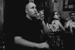 Man watching TV in a Bar, Madrid. 2019.